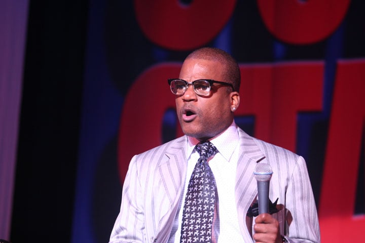 Ralph Harris wearing glasses on stage