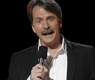 Jeff Foxworthy holds a microphone