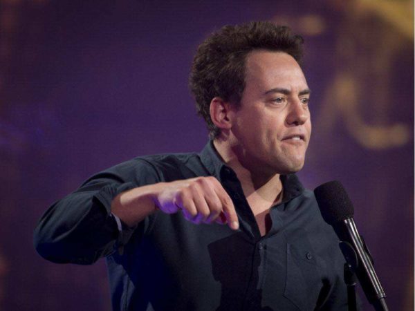 Orny Adams on stage pointing down