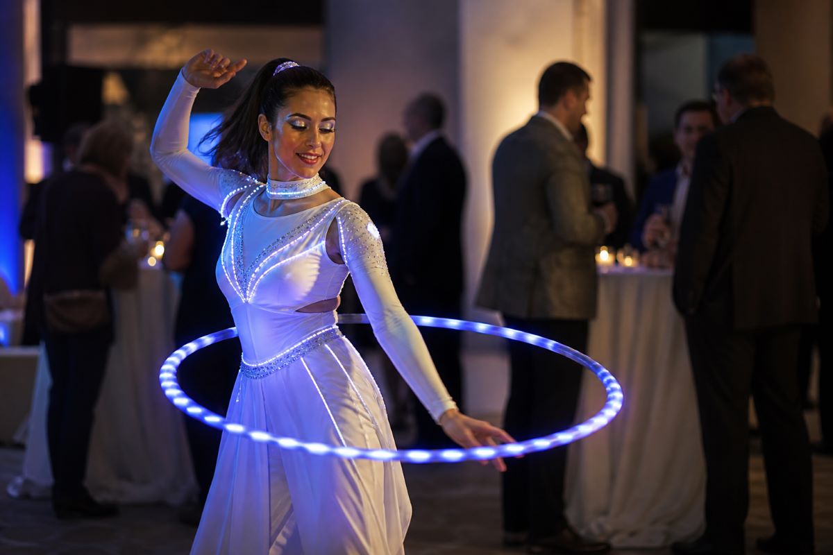 LED glow performer entertaining guests during a corporate cocktail reception