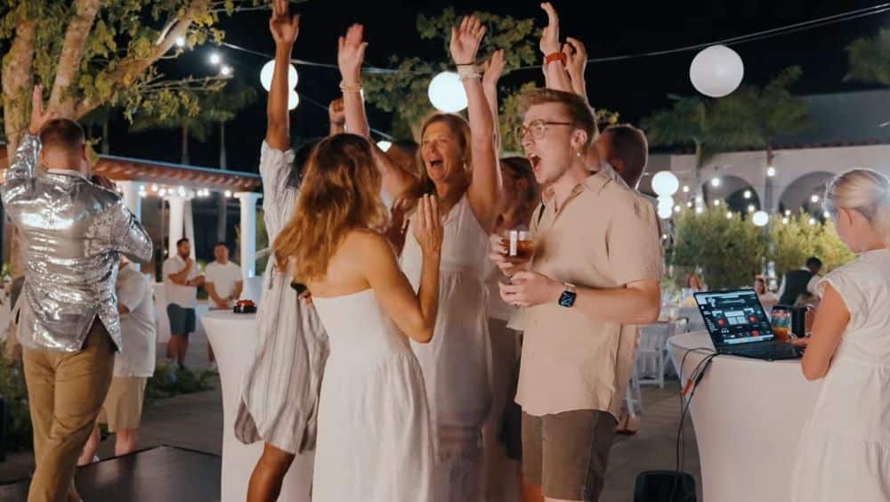 Employees dancing and celebrating at a corporate retreat entertainment event